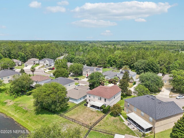 76466 Long Leaf Loop, Yulee, FL 32097 - aerial perspective of suburban area with a forest
