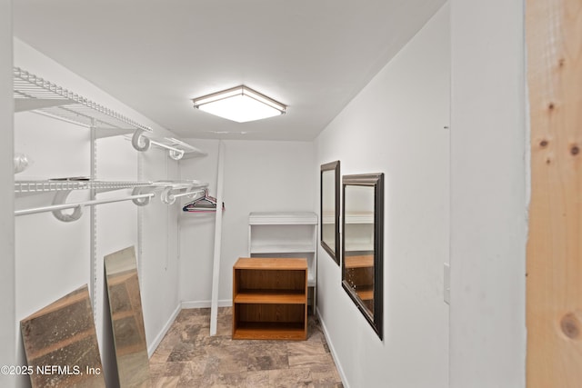 112 Sculpin Dr, Florahome, FL 32140 - spacious closet featuring stone finish floors