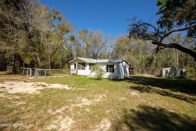 112 Sculpin Dr, Florahome, FL 32140 - view of yard featuring a storage shed and an outbuilding