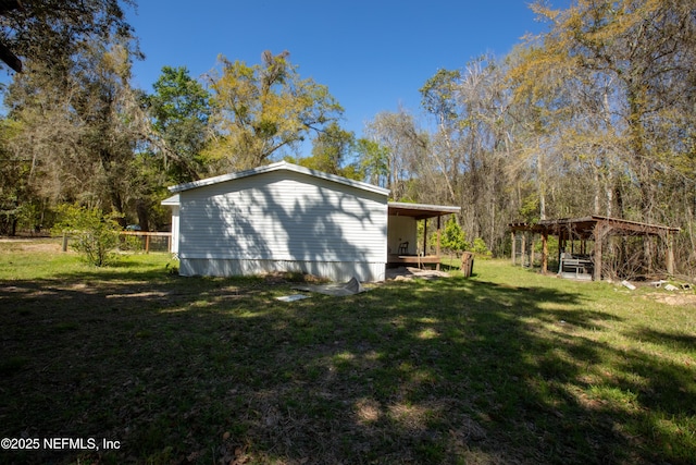 112 Sculpin Dr, Florahome, FL 32140 - view of side of home with a yard