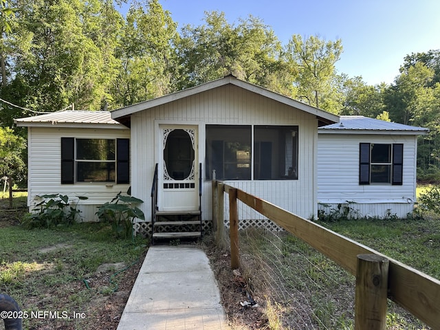 112 Sculpin Dr, Florahome, FL 32140 - view of front of property featuring entry steps and metal roof
