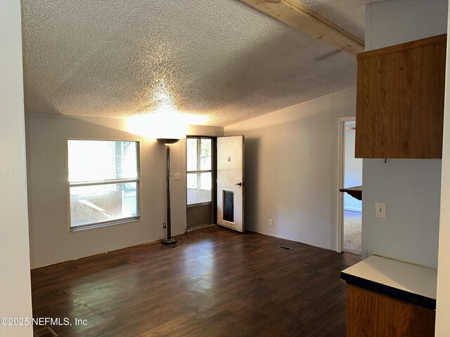112 Sculpin Dr, Florahome, FL 32140 - unfurnished living room with a textured ceiling and dark wood finished floors