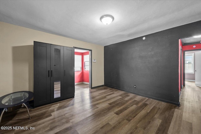 2058 W 40th St, Jacksonville, FL 32209 - unfurnished bedroom with wood finished floors and baseboards