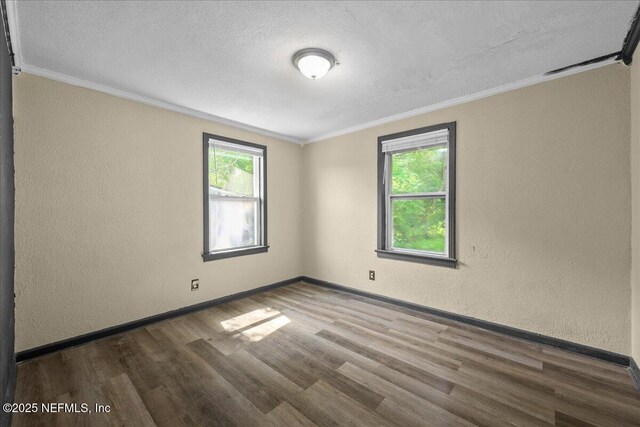 2058 W 40th St, Jacksonville, FL 32209 - unfurnished room with a textured wall, plenty of natural light, wood finished floors, crown molding, and a textured ceiling