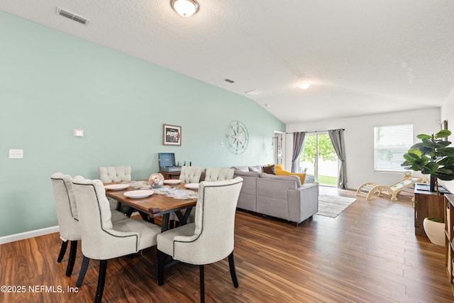 2840 Buck Creek Pl, Green Cove Springs, FL 32043 - dining space featuring lofted ceiling, dark wood-style floors, and baseboards