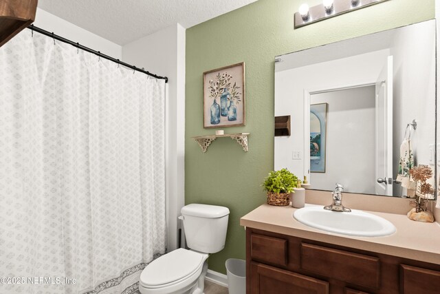 2840 Buck Creek Pl, Green Cove Springs, FL 32043 - bathroom featuring toilet, vanity, a textured ceiling, and a shower with shower curtain