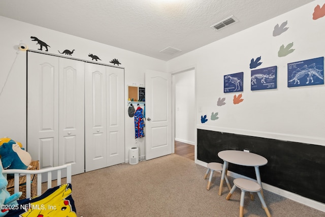 2840 Buck Creek Pl, Green Cove Springs, FL 32043 - bedroom featuring carpet flooring, a textured ceiling, and a closet