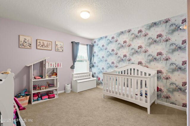 2840 Buck Creek Pl, Green Cove Springs, FL 32043 - carpeted bedroom with a textured ceiling, a crib, baseboards, and wallpapered walls