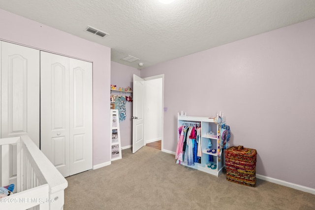 2840 Buck Creek Pl, Green Cove Springs, FL 32043 - carpeted bedroom with a closet, baseboards, and a textured ceiling