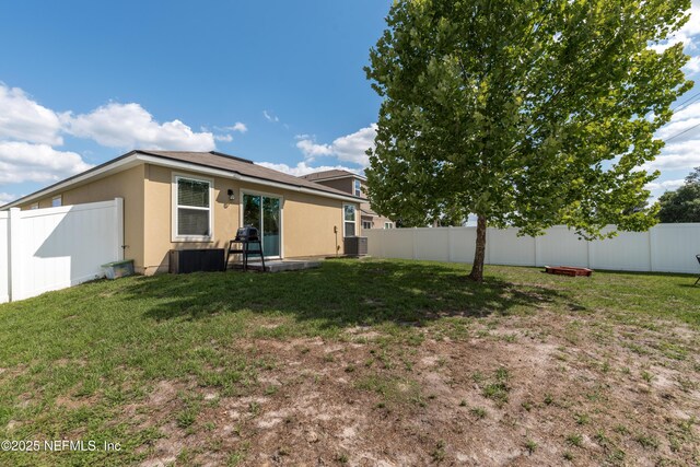 2840 Buck Creek Pl, Green Cove Springs, FL 32043 - rear view of property with stucco siding and central AC