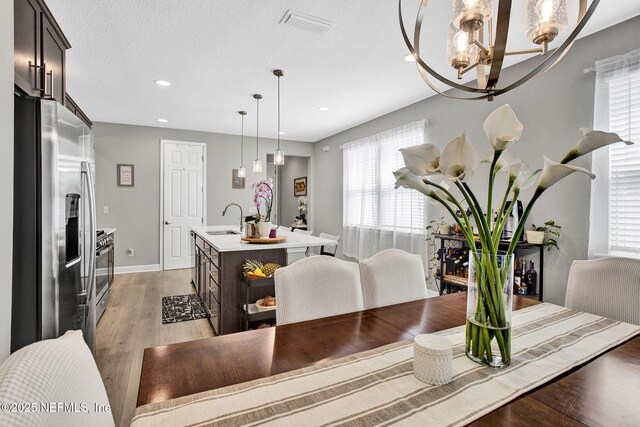 267 Honeycomb Trl, Saint Augustine, FL 32095 - dining space featuring a chandelier, plenty of natural light, light wood-style floors, recessed lighting, and baseboards