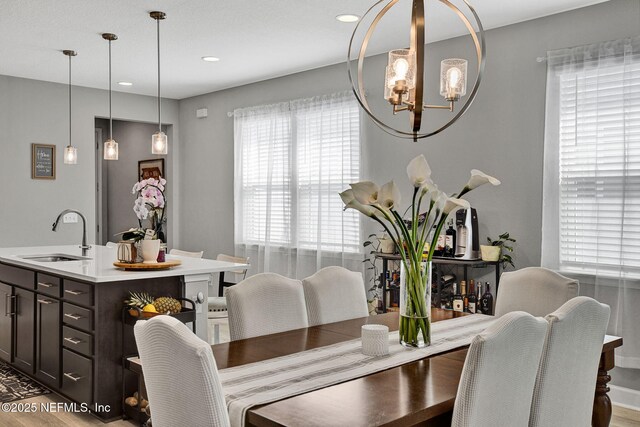 267 Honeycomb Trl, Saint Augustine, FL 32095 - dining room with a chandelier, wood finished floors, and recessed lighting