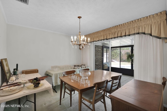 359 Carson Dr, Orange Park, FL 32073 - dining space featuring a chandelier and crown molding