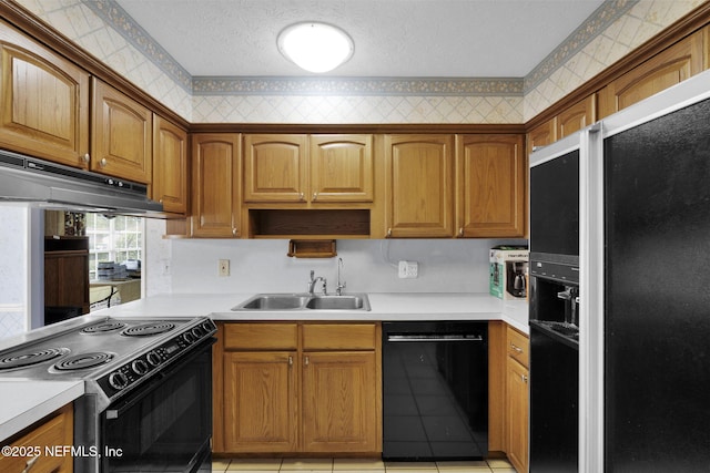 359 Carson Dr, Orange Park, FL 32073 - kitchen with black appliances, a sink, light countertops, under cabinet range hood, and a textured ceiling