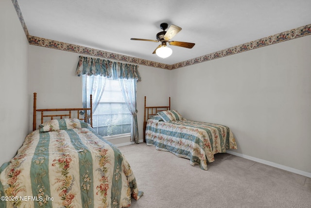 359 Carson Dr, Orange Park, FL 32073 - carpeted bedroom featuring baseboards and a ceiling fan