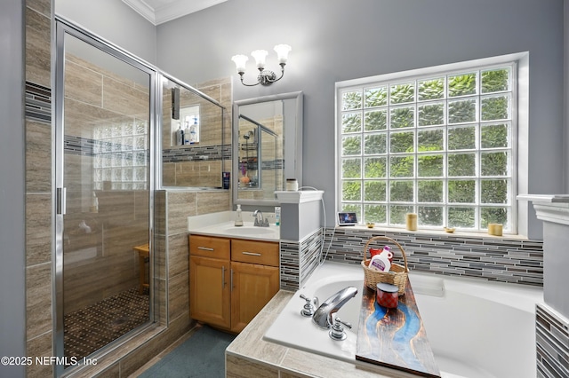 85053 Sagaponack Dr, Fernandina Beach, FL 32034 - full bathroom with a shower stall, a garden tub, ornamental molding, vanity, and a chandelier