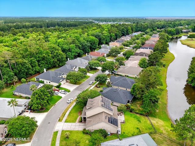 85053 Sagaponack Dr, Fernandina Beach, FL 32034 - aerial view of residential area featuring a large body of water and a heavily wooded area