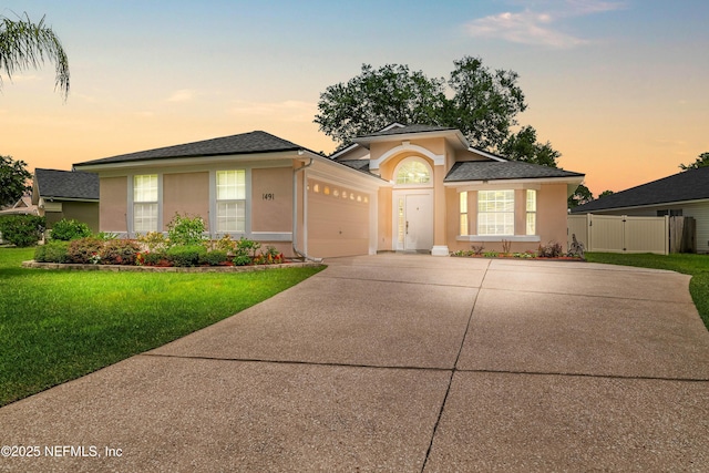 1491 Cedar Grove Ter, Fleming Island, FL 32003 - ranch-style house with stucco siding, driveway, and a garage