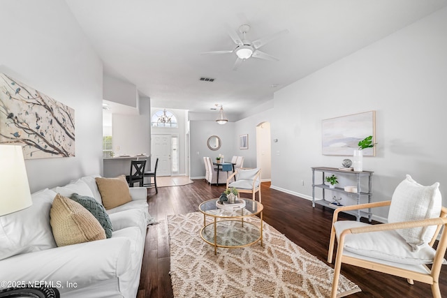 1491 Cedar Grove Ter, Fleming Island, FL 32003 - living room with a ceiling fan, arched walkways, wood finished floors, and baseboards