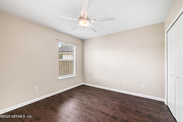 1491 Cedar Grove Ter, Fleming Island, FL 32003 - empty room with dark wood-style floors, baseboards, a ceiling fan, and a textured ceiling