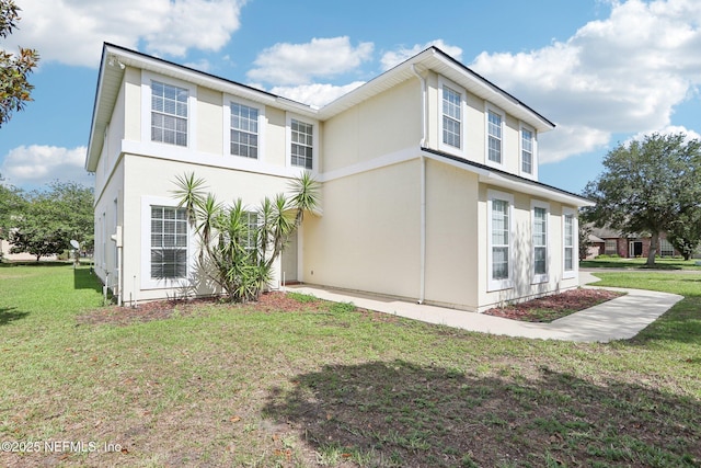 2454 Woodstork Ct, Saint Augustine, FL 32092 - view of side of home with a yard