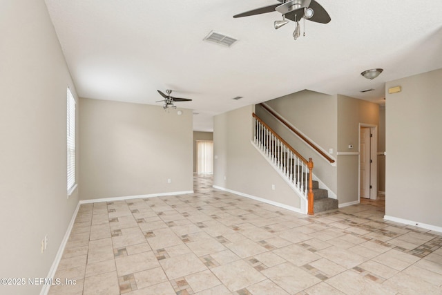 2454 Woodstork Ct, Saint Augustine, FL 32092 - unfurnished living room with a ceiling fan, stairway, and baseboards