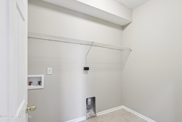 2454 Woodstork Ct, Saint Augustine, FL 32092 - clothes washing area featuring washer hookup, electric dryer hookup, and baseboards