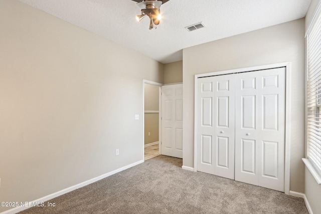 2454 Woodstork Ct, Saint Augustine, FL 32092 - unfurnished bedroom featuring carpet floors, a closet, baseboards, and a ceiling fan