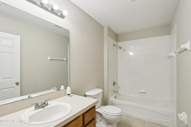 2454 Woodstork Ct, Saint Augustine, FL 32092 - full bathroom featuring toilet, vanity, shower / bath combination, tile patterned flooring, and a textured ceiling