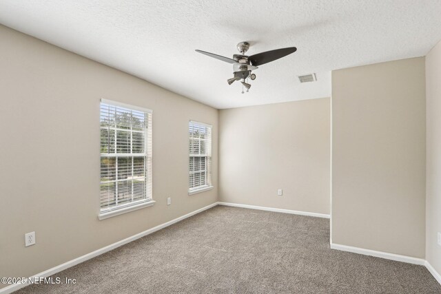 2454 Woodstork Ct, Saint Augustine, FL 32092 - carpeted empty room featuring ceiling fan, baseboards, and a textured ceiling