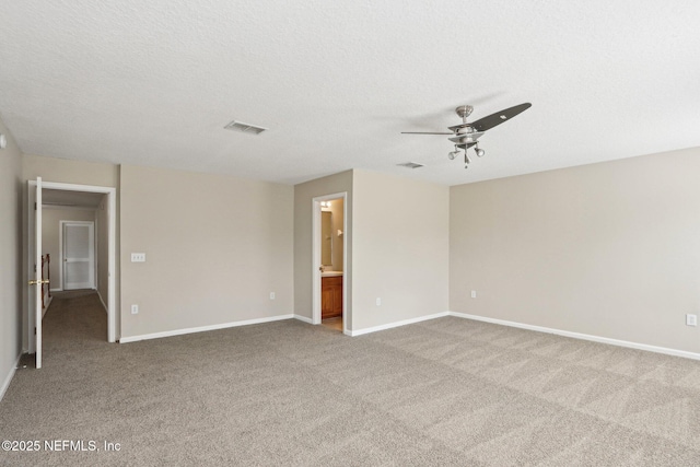 2454 Woodstork Ct, Saint Augustine, FL 32092 - empty room with ceiling fan, carpet, baseboards, and a textured ceiling