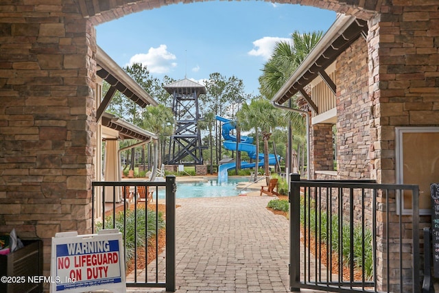 2454 Woodstork Ct, Saint Augustine, FL 32092 - view of patio / terrace featuring a community pool