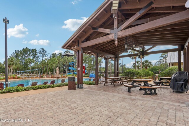 2454 Woodstork Ct, Saint Augustine, FL 32092 - view of patio / terrace with a community pool, a grill, and a gazebo