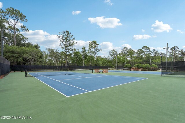 2454 Woodstork Ct, Saint Augustine, FL 32092 - view of tennis court with fence and community basketball court