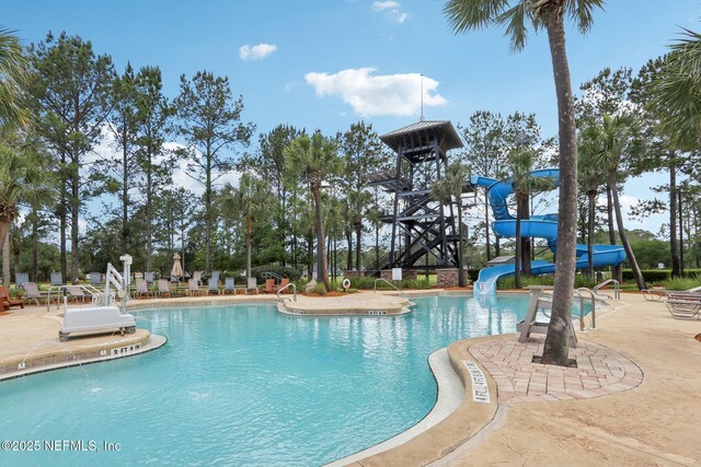 2454 Woodstork Ct, Saint Augustine, FL 32092 - community pool featuring a water slide and a patio