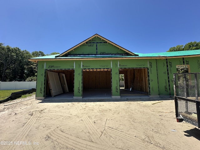 garage with fence