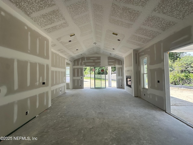 809 Brandywine Ct, Saint Augustine, FL 32086 - unfurnished living room featuring lofted ceiling