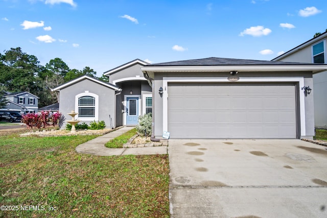 15831 Baxter Creek Dr, Jacksonville, FL 32218 - ranch-style house with stucco siding, an attached garage, and driveway