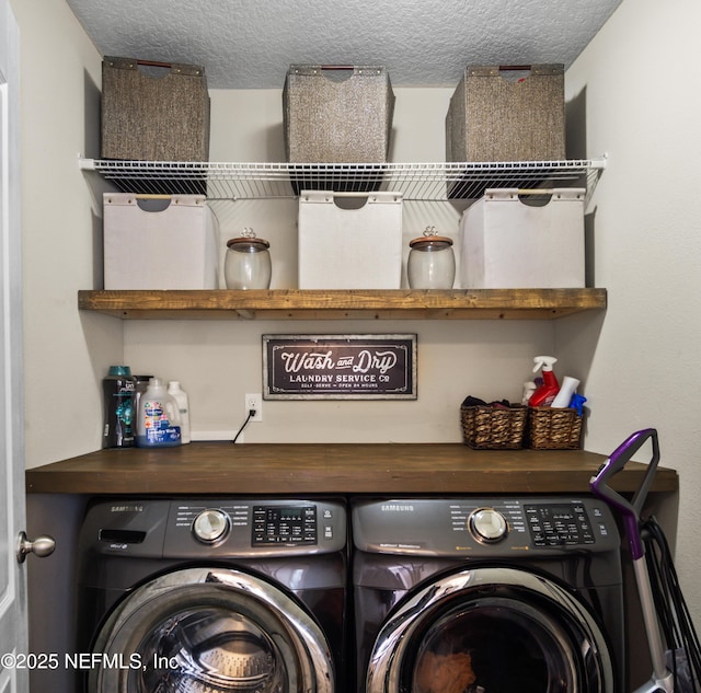 15831 Baxter Creek Dr, Jacksonville, FL 32218 - laundry area with washing machine and dryer and a textured ceiling