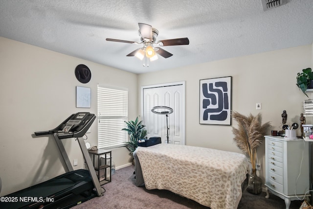 15831 Baxter Creek Dr, Jacksonville, FL 32218 - bedroom with carpet, a ceiling fan, baseboards, a closet, and a textured ceiling
