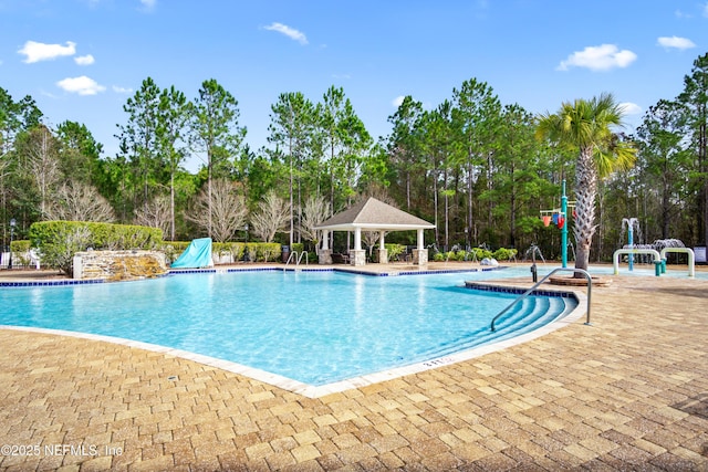 15831 Baxter Creek Dr, Jacksonville, FL 32218 - community pool featuring view of wooded area, a gazebo, and a patio