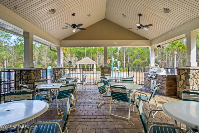15831 Baxter Creek Dr, Jacksonville, FL 32218 - view of patio / terrace featuring an outdoor kitchen, ceiling fan, area for grilling, and fence