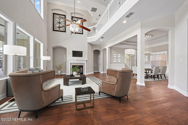 1211 Spring Branch Rd, Saint Johns, FL 32259 - living area featuring ceiling fan, baseboards, hardwood / wood-style flooring, arched walkways, and crown molding