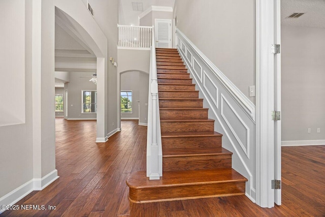 1211 Spring Branch Rd, Saint Johns, FL 32259 - stairs with hardwood / wood-style flooring, baseboards, ceiling fan, and arched walkways