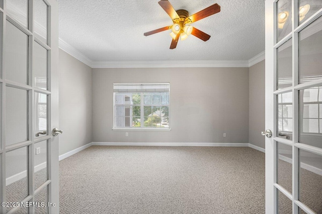 1211 Spring Branch Rd, Saint Johns, FL 32259 - spare room with french doors, carpet floors, crown molding, baseboards, and a textured ceiling