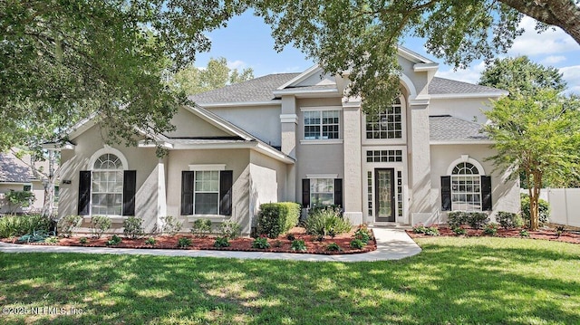 1211 Spring Branch Rd, Saint Johns, FL 32259 - view of front of property with stucco siding, a front lawn, and a shingled roof