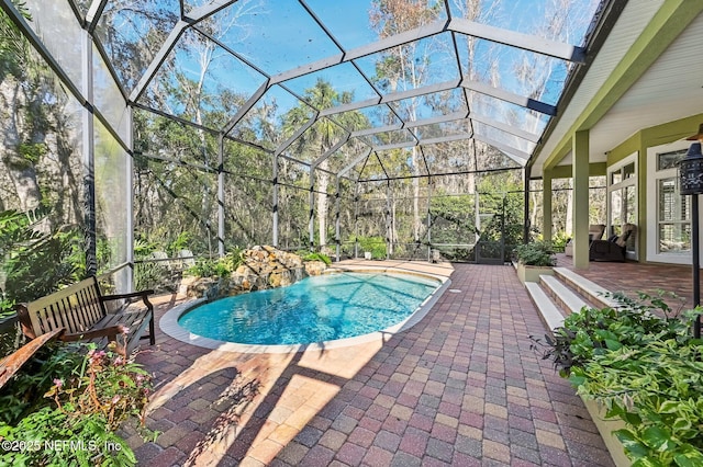 3461 Mainard Branch Ct, Fleming Island, FL 32003 - swimming pool featuring a patio and glass enclosure
