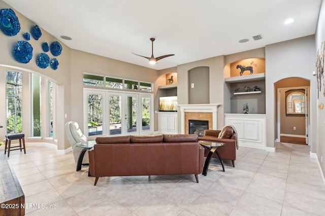 3461 Mainard Branch Ct, Fleming Island, FL 32003 - living area featuring built in features, baseboards, light tile patterned floors, a tile fireplace, and recessed lighting
