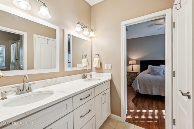 3461 Mainard Branch Ct, Fleming Island, FL 32003 - full bathroom with connected bathroom, double vanity, tile patterned floors, and baseboards