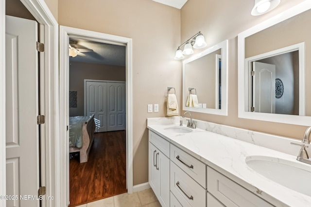 3461 Mainard Branch Ct, Fleming Island, FL 32003 - bathroom with double vanity, ceiling fan, and baseboards